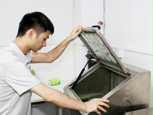 GripSeal employees inspect machines